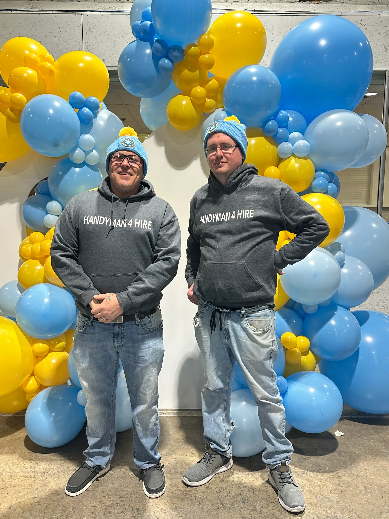 Robert and a crew member in Handyman 4 Hire hoodies with balloons