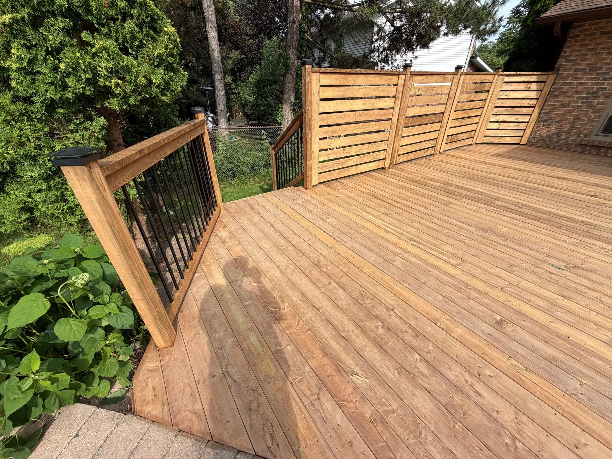 Wood deck boards and privacy screen