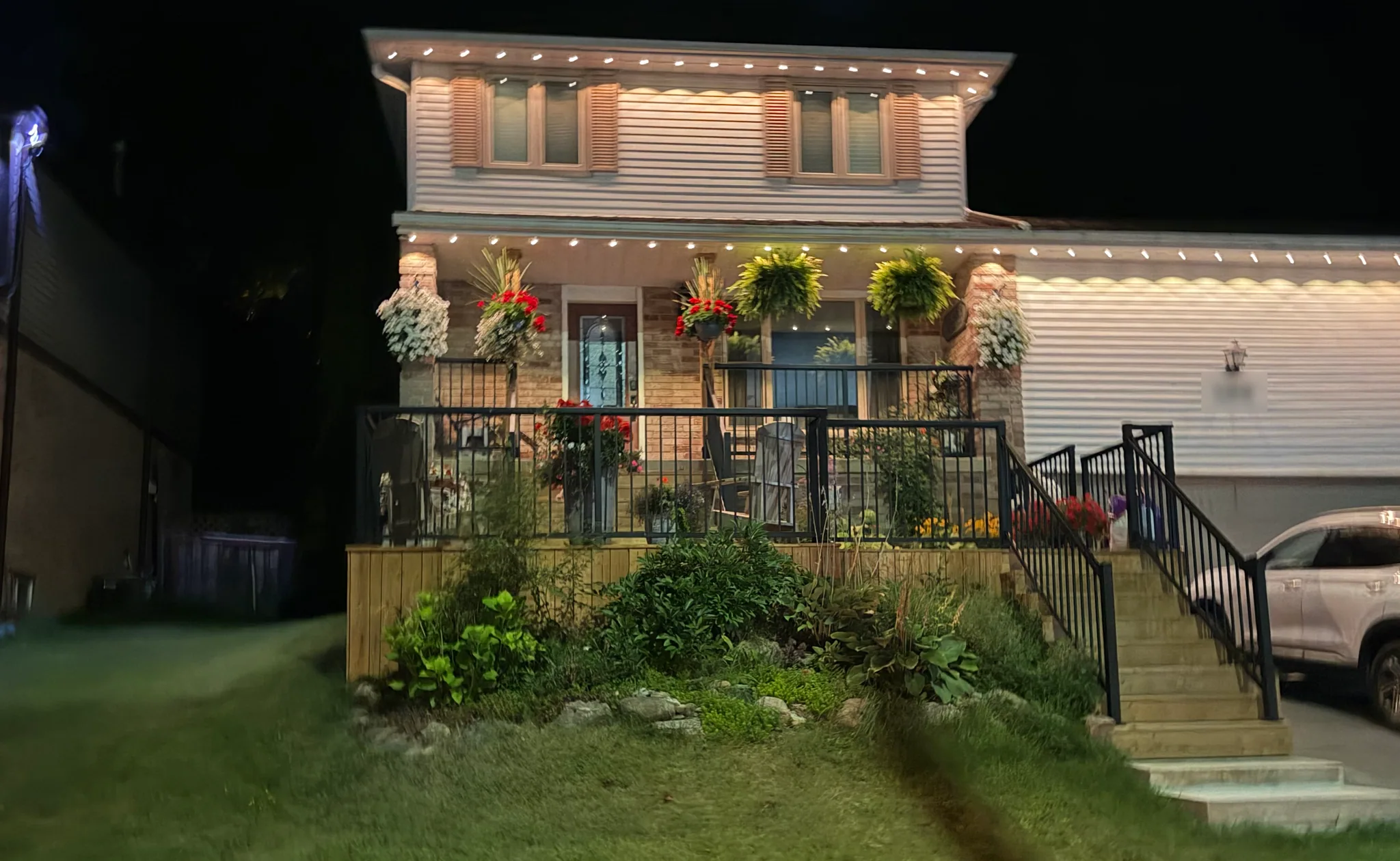 Front deck and stairs lit up at night