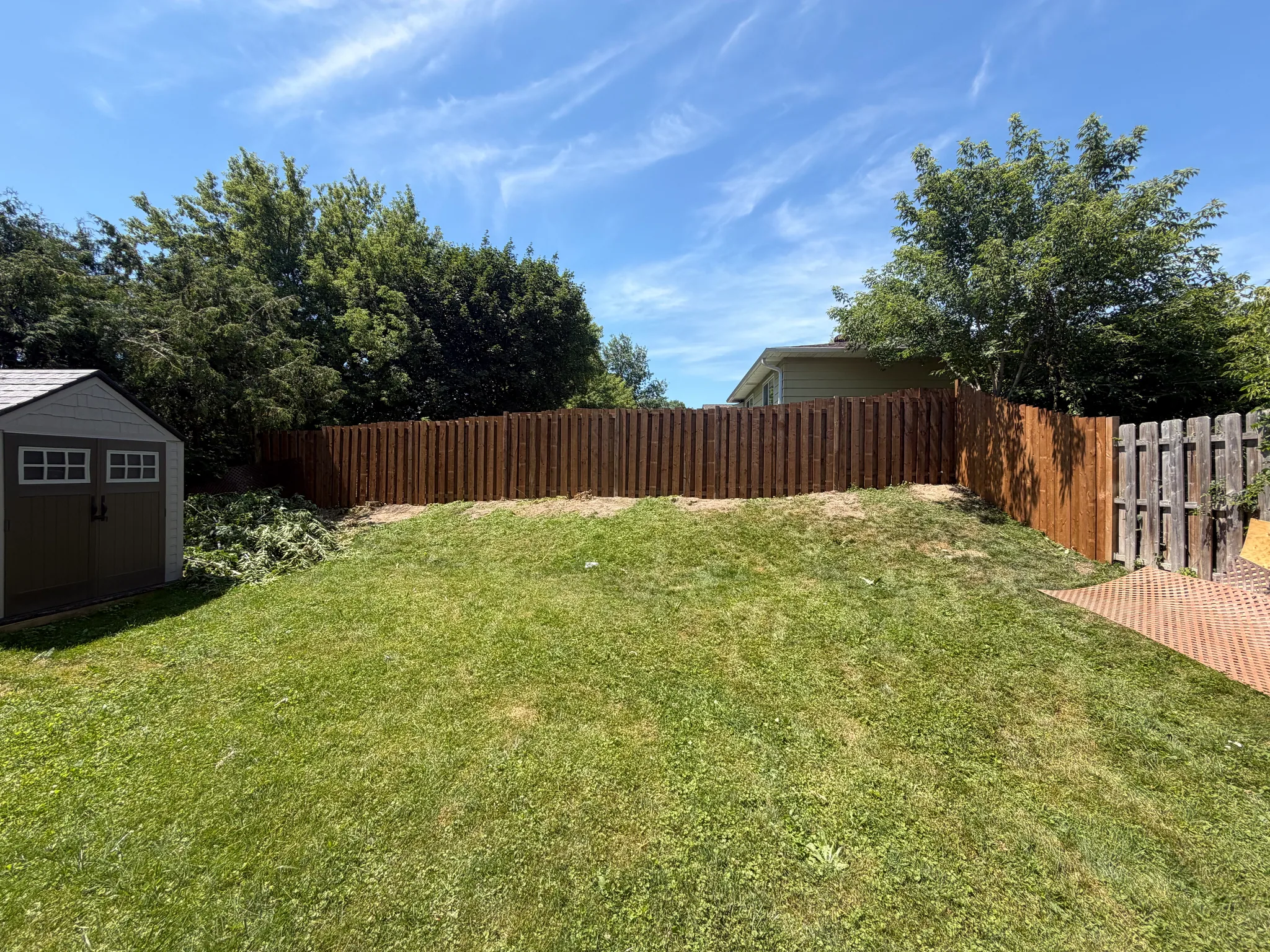 New wood fence around a backyard