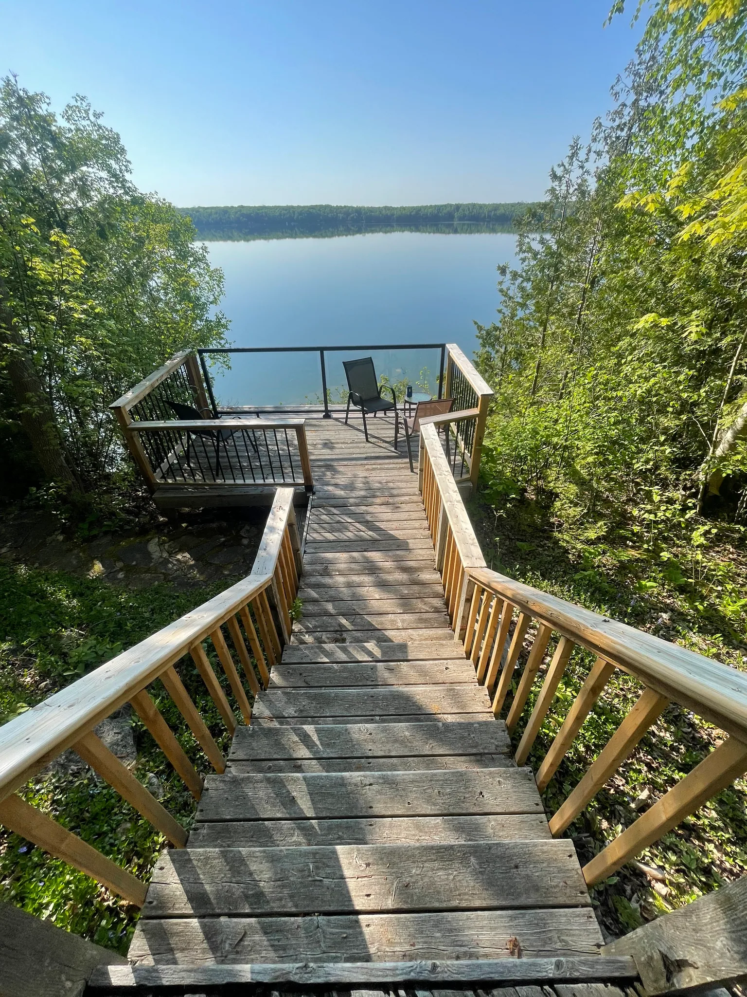 Weathered wood stairs and lakeside lookout before repairs