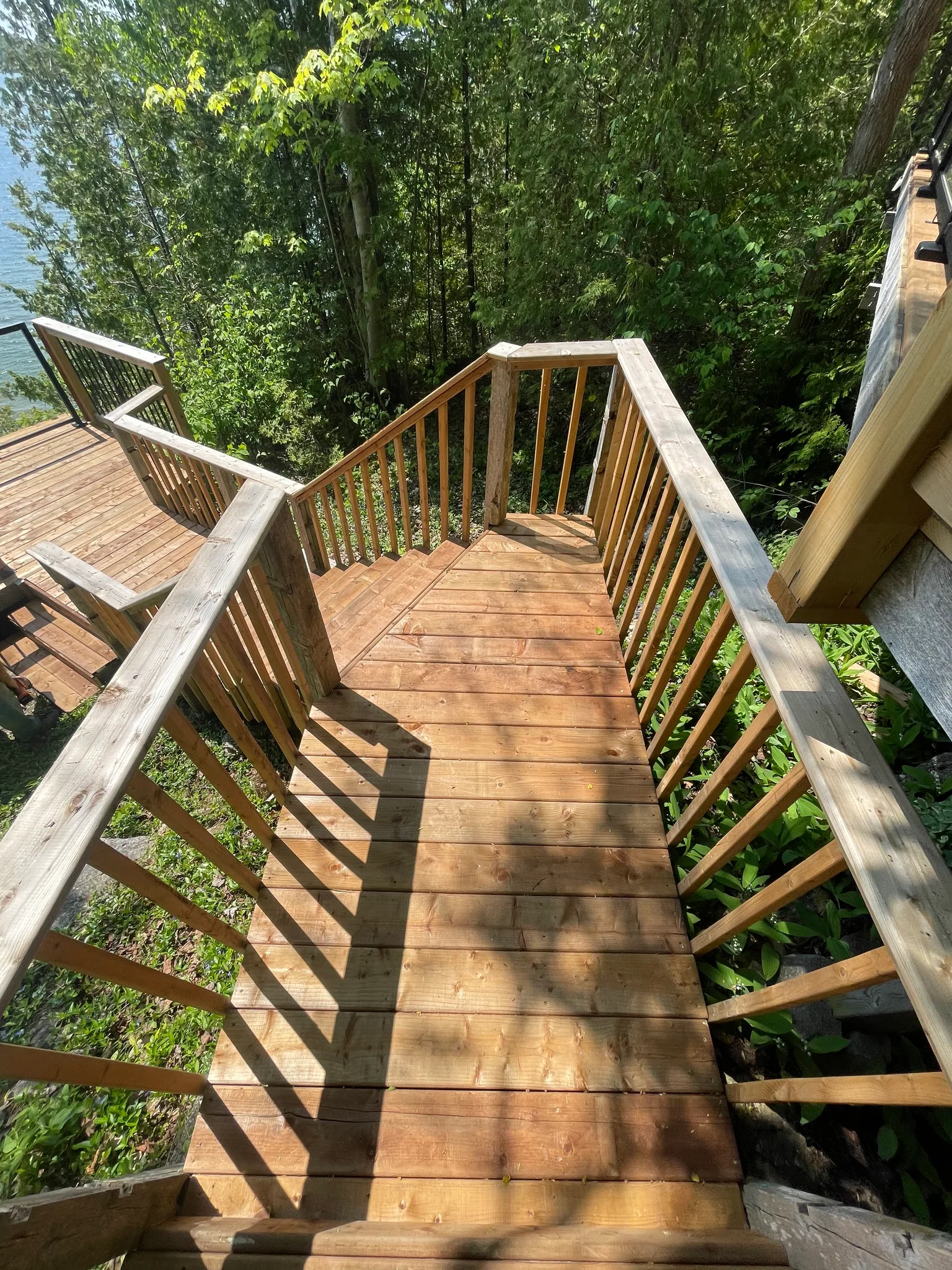 Wood stair landing above a lakeside lookout