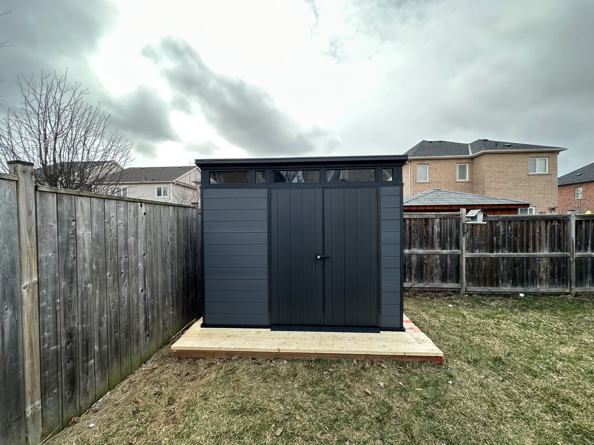 Backyard shed on a wood base